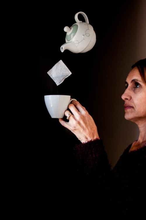 woman holding teacup